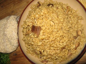 Plate of pearl barley cooked with dried porcini, and a bag of dried pearl barley
