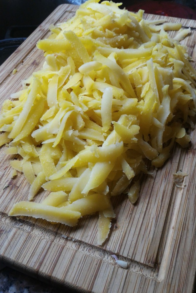 Yukon gold potatoes parboiled for 12 minutes, peeled , shredded on box grater.