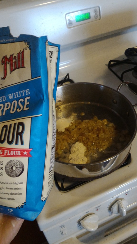 Add flour into onions, garlic, and butter to make roux.